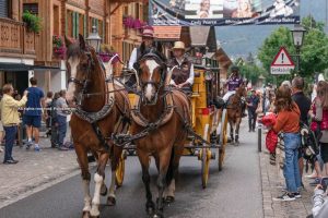 A colorful players parade through the streets of Gstaad